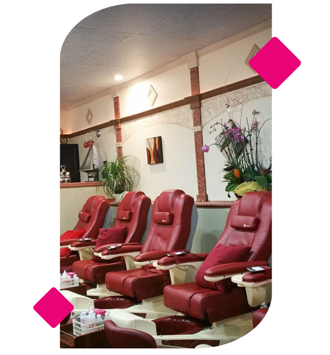 A shop with four red nail spa chairs