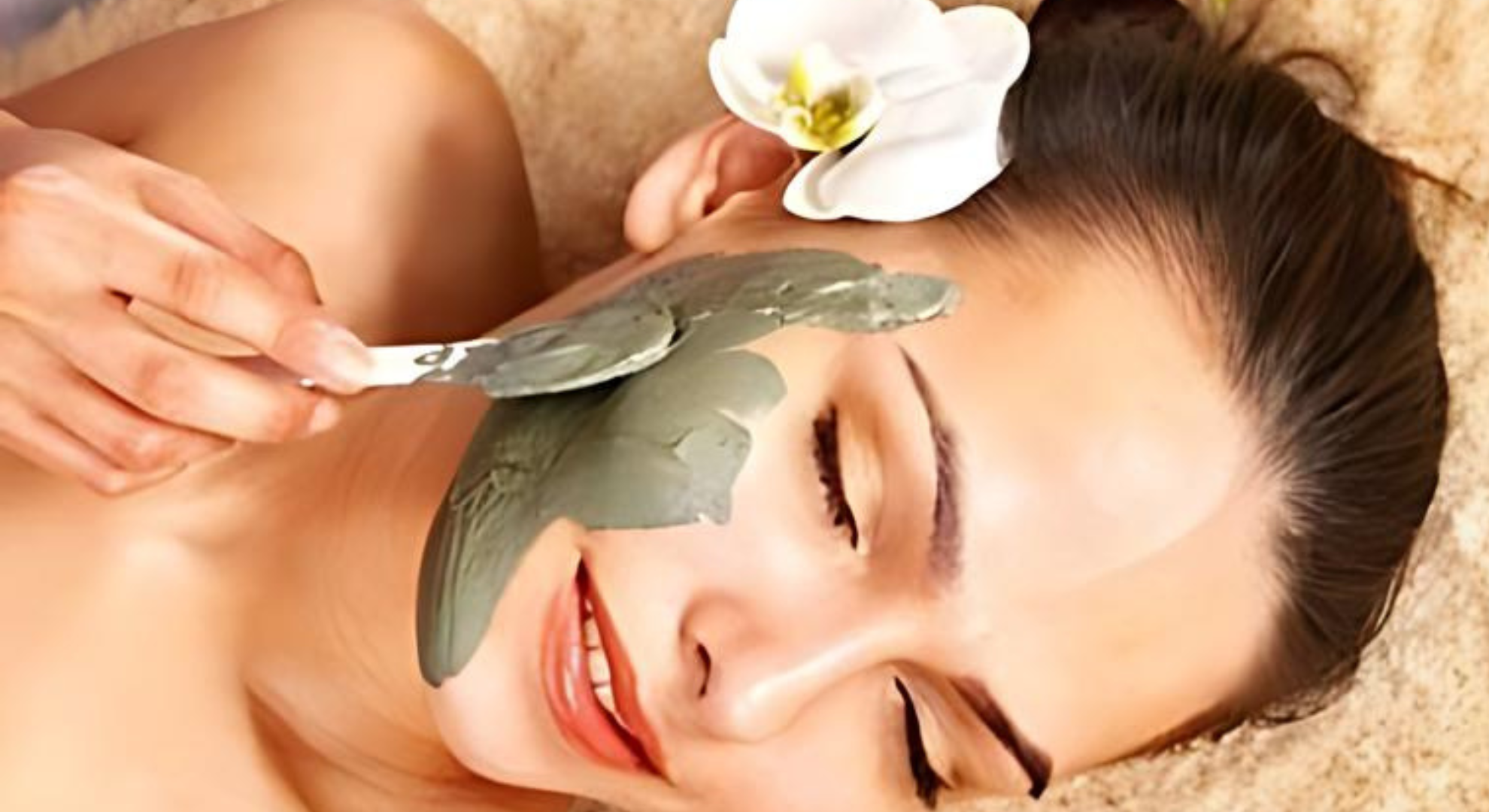 a woman smiling to have a facial wax and treatment